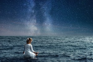 serenity and yoga practicing at the sea under night sky