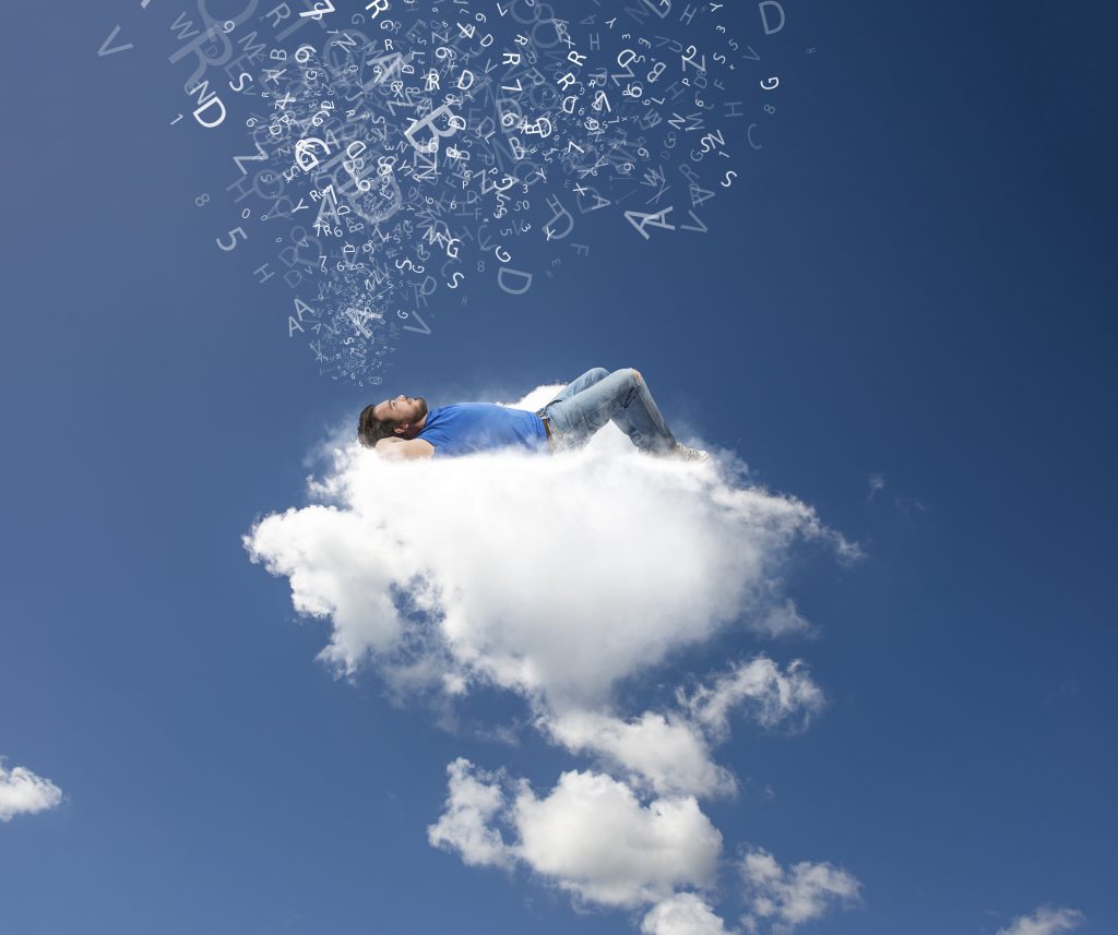 A boy relaxing on a soft cloud